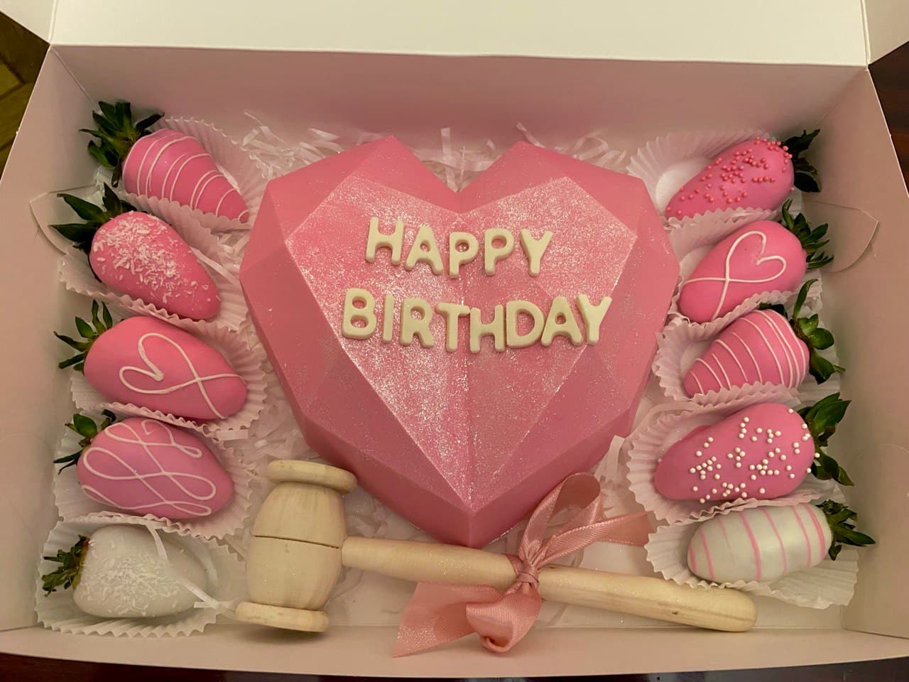 breakable chocolate heart with strawberries